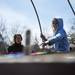 Ypsilanti resident Grace Rinehart (right), 7, learns about a rainbow garden from Amelia Stefanac during Earth Day on Sunday, April 21. AnnArbor.com I Daniel Brenner